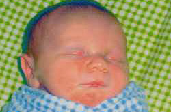 Close up of bundled, sleeping infant
