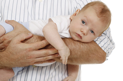 A man holding a baby