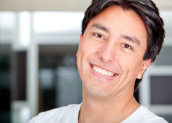 A man smiling in a room