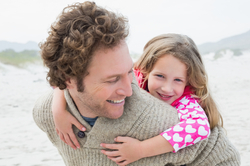 A father with his daughter outside